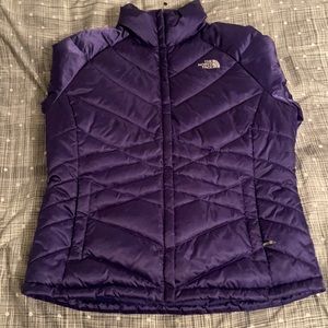 Darker purple North Face jacket/coat. Fits M-L.